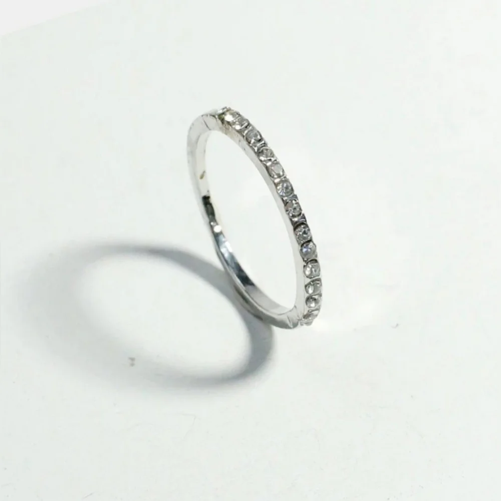 Thin Silver-Toned Dainty Band With Cubic Zirconia Accents - Size 7